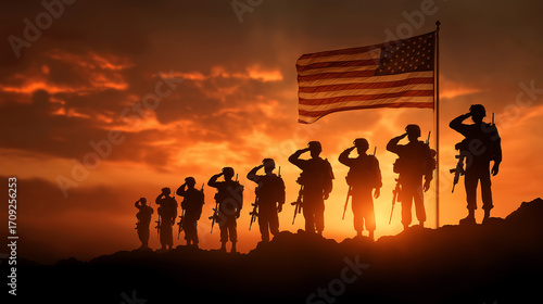 Veterans day honoring military soldiers with american flag at sunset