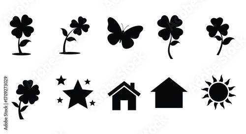 Black silhouettes of clovers a butterfly stars and house shapes