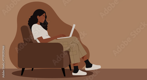 A young woman works remotely or studies from home, comfortably seated in an armchair with her laptop. Ideal for lifestyle, freelance, and online learning concepts.