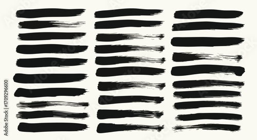 Collection of black brush strokes with varying textures and widths, arranged in rows.