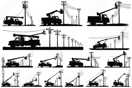 Silhouettes of utility trucks and workers on power poles