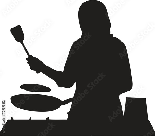 Silhouette of a person cooking with a spatula pan