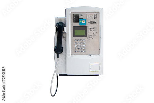 Public grey old payphone coin in glass public telephone booth isolated on cutout PNG or transparent background. Since most people use cell phones. Vintage interior decoration.