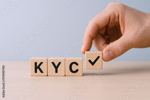 KYC Compliance Verification: Hand Completing Acronym with Checkmark Block, Business Regulation Concept and Identity Authentication, Close-up