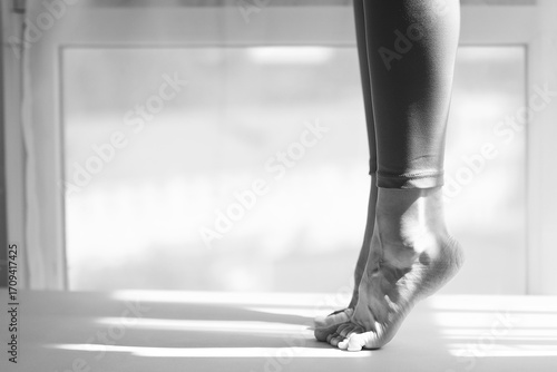 Wallpaper Mural The girl is standing on her toes, legs in close-up Torontodigital.ca