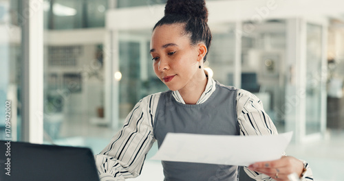 Typing, info and woman with laptop, office or data entry with documents, financial report or online. Corporate, account manager and person with paperwork for record keeping, planning and research