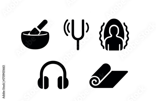Symbols of sound healing and relaxation: singing bowl, tuning fork, meditation, headphones, yoga mat