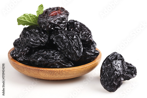 Quadro su tela Xinjiang Air-Dried Prunes Candied Preserved Fruit in Wooden Bowl White Backgroun