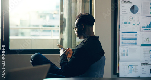 Canvas Print Phone, business and black man in office for financial forecast, company expenditure and graphs