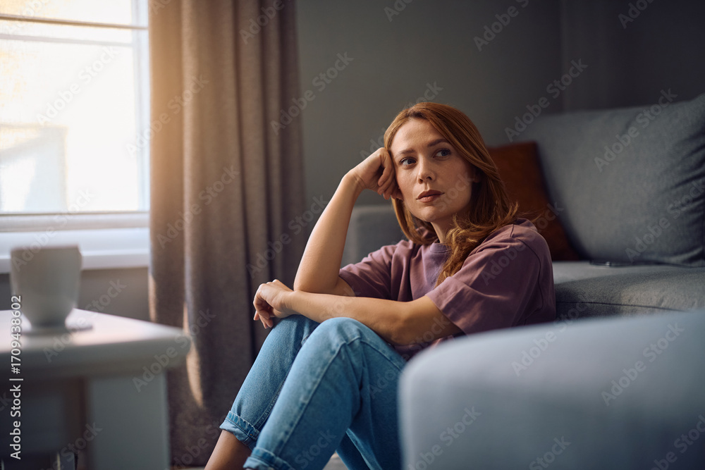 Obraz premium Thoughtful woman thinking of her problems at home.