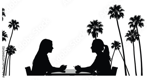 Silhouetted couple enjoying a romantic moment beneath swaying palm trees