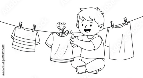 A happy child is helping to hang clothes on a drying line outside.