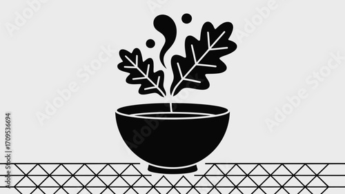 A black silhouette illustration of a bowl with leaves and steam on a triangular patterned surface