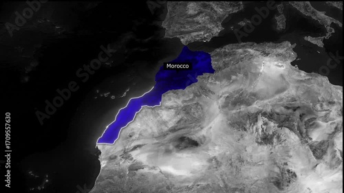Aerial view of morocco highlighted in blue against a grayscale landscape and dark ocean background