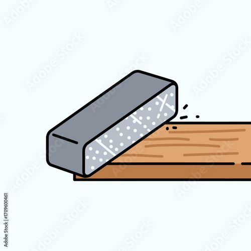 Close-up flat lay of a gray sanding block smoothing a light brown wooden plank, showing wood shavings, against a light blue background, conveying a calm and neutral mood.