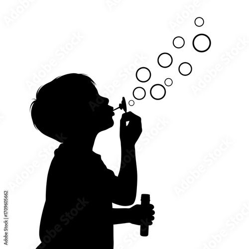 little boy blowing bubbles