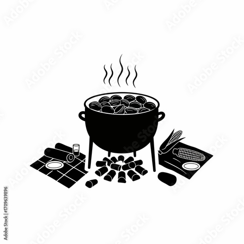 Rustic black kettle of stew cooking over open fire with ingredients and utensils