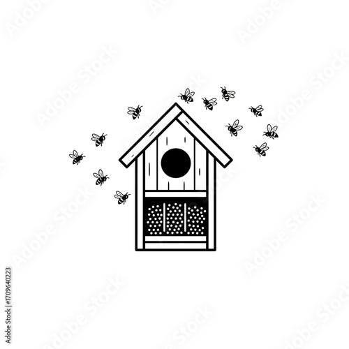 Charming bee hotel designed for attracting pollinators in a garden setting attracting bees to its wooden structure