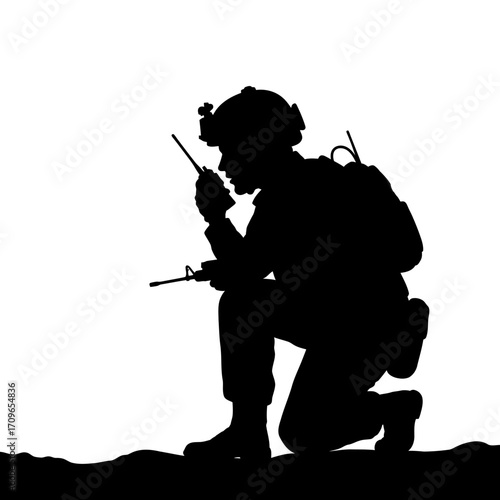 Silhouette of a kneeling soldier communicating on a radio with tactical gear and backpack
