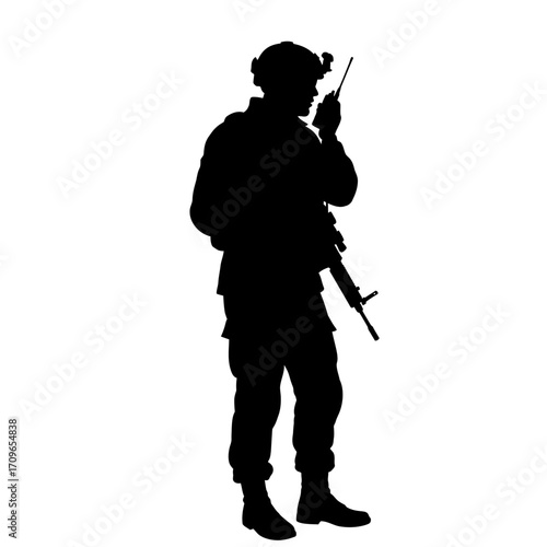 Silhouette of a soldier in tactical gear holding a rifle and radio communication device ready for action