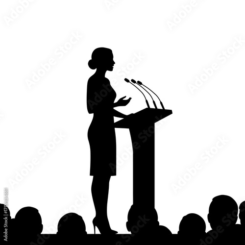 Silhouette of a woman speaking at a podium with microphones to an audience
