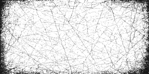 Gritty black and white grunge metal texture with a rough cracked cement surface for a dirty old wall pattern design