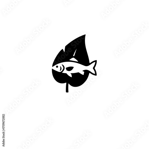 A clever and cohesive icon featuring a solid leaf silhouette. Within the negative space of the leaf, a fish silhouette is formed. This design intelligently merges flora (the leaf) and fauna (the fish)
