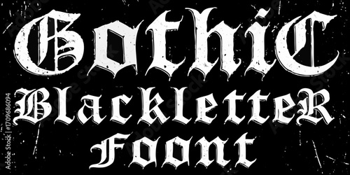 Gothic blackletter font typography with grunge texture on black background