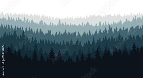 Layers of dark evergreen trees stretching across the horizon in a gradient of blue and grey.