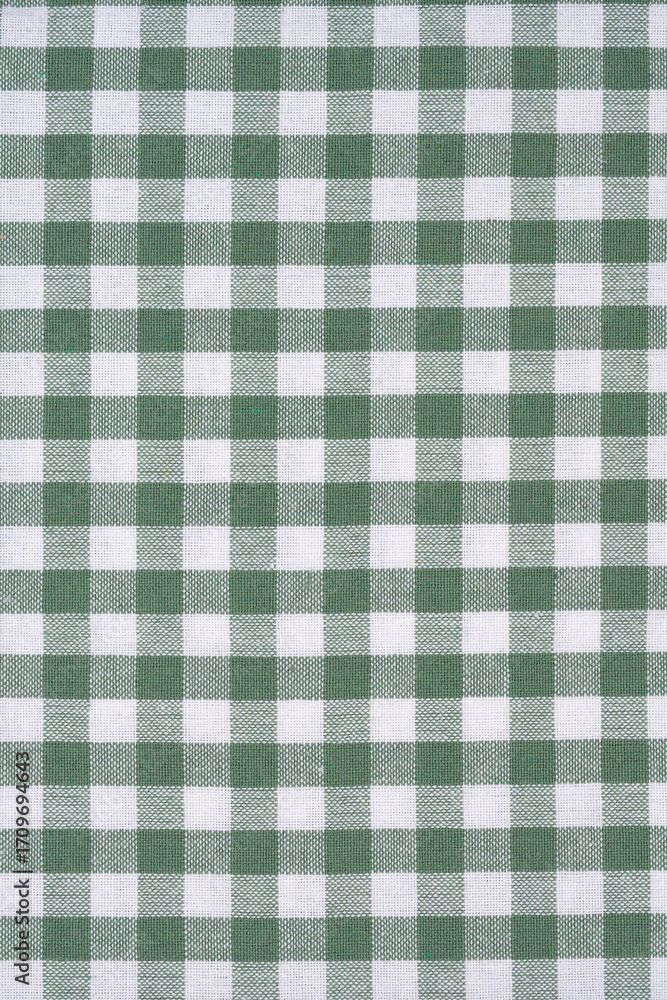 Obraz premium A close-up, high-angle shot of a green and white gingham checked tablecloth detail