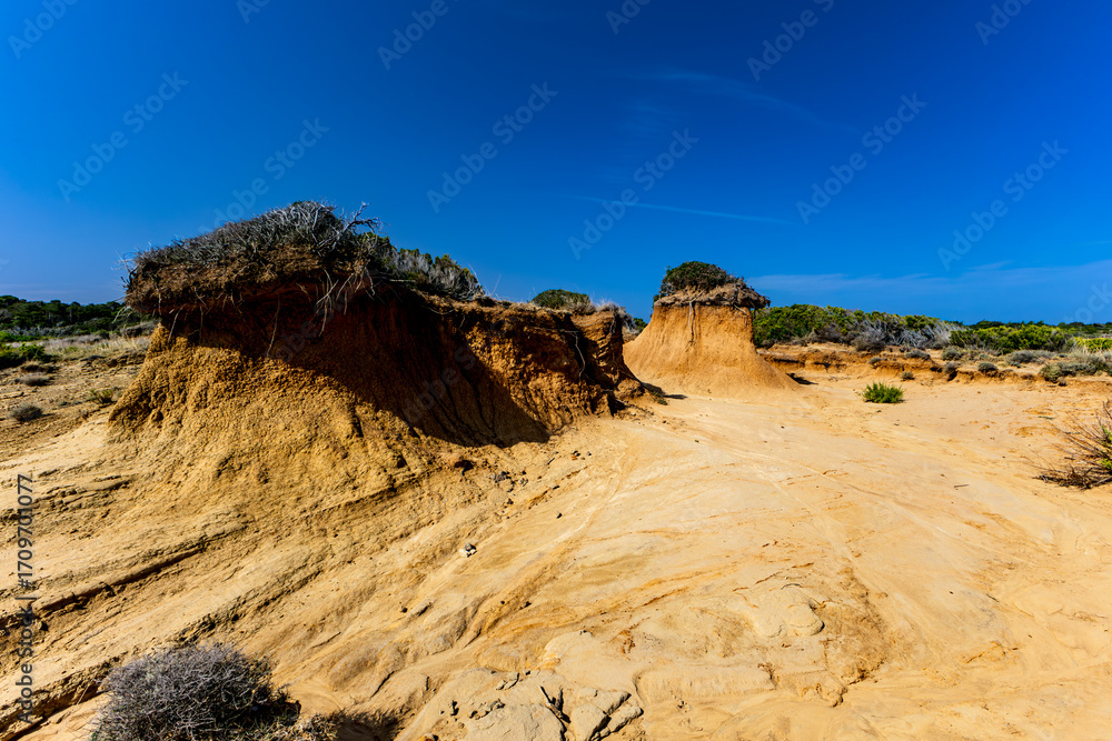 Naklejka premium Rab, Sand dunes, rock formations, and a trail leading to the FKK Ciganka naturist beach on the island of Rab