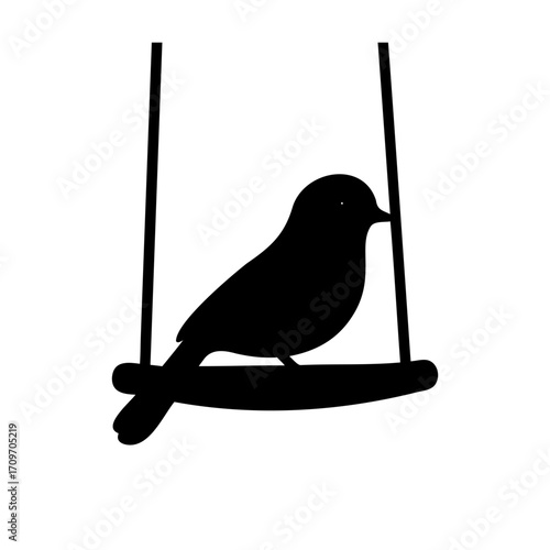 Silhouette of a small bird resting peacefully on a hanging perch