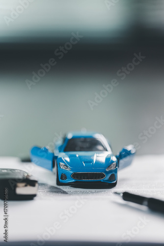 Car loan approval concept. Client finalizes purchase of vehicle by signing contract includes auto loan, insurance, credit terms, making car smart financial investment business-backed finance option.