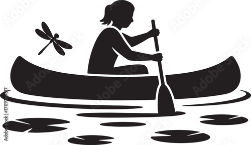 Silhouette of a Person Canoeing on a Lake with Lily Pads and a Dragonfly in the Air