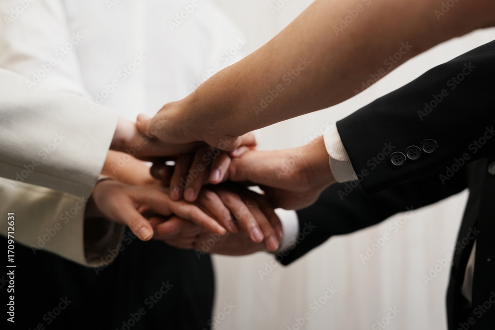 Obraz premium The group of employees hand in hand to show the best teamwork collaboration .Membership togetherness partnership and success Concept