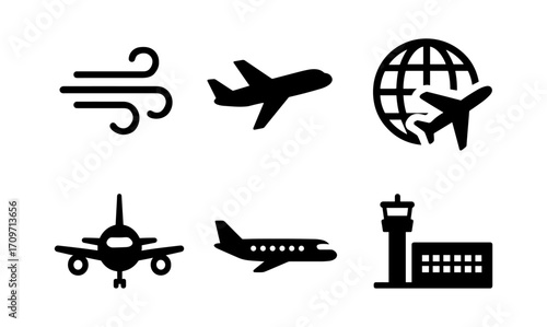 Silhouette icons of air travel: planes, globe, and control tower