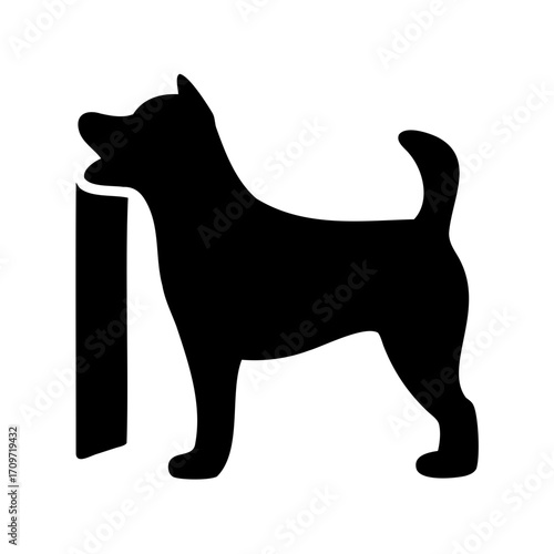 Silhouette of a dog marking its territory by peeing on a pole
