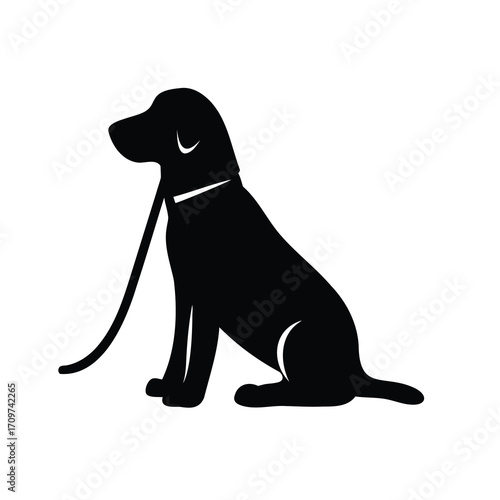 Silhouette of a loyal Labrador Retriever sitting with a leash attached