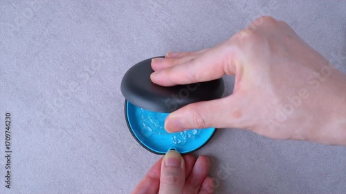 Opening blue dental aligner case that are  orthodontic mouthpiece storage in marble background.