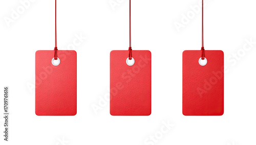 Three red tags, hanging, with string and small metal ring