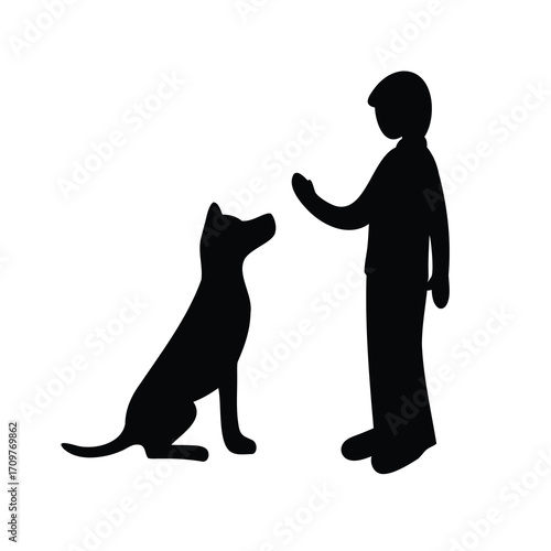 Silhouette of a dog and a person training or interacting with it