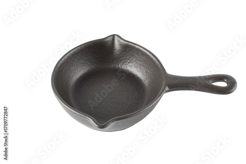 Black ceramic sauce bowl, in the shape of a frying pan, isolated on a white background.