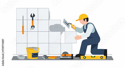 Tile installation in bathroom showing worker spreading adhesive for tile installation. Process tile installation involves plastering adhesive for ceramic tiles, and tools lying nearby.