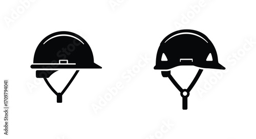 Two black and white construction helmets with chin straps displayed