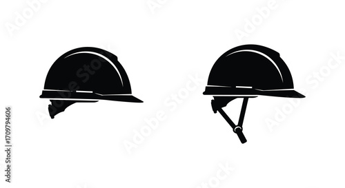 Two black safety helmets displayed on a plain white background