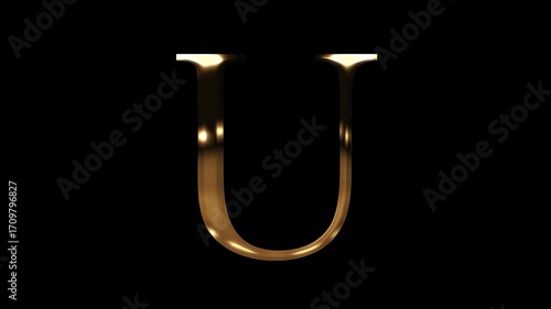 Golden uppercase alphabet reflecting light 
