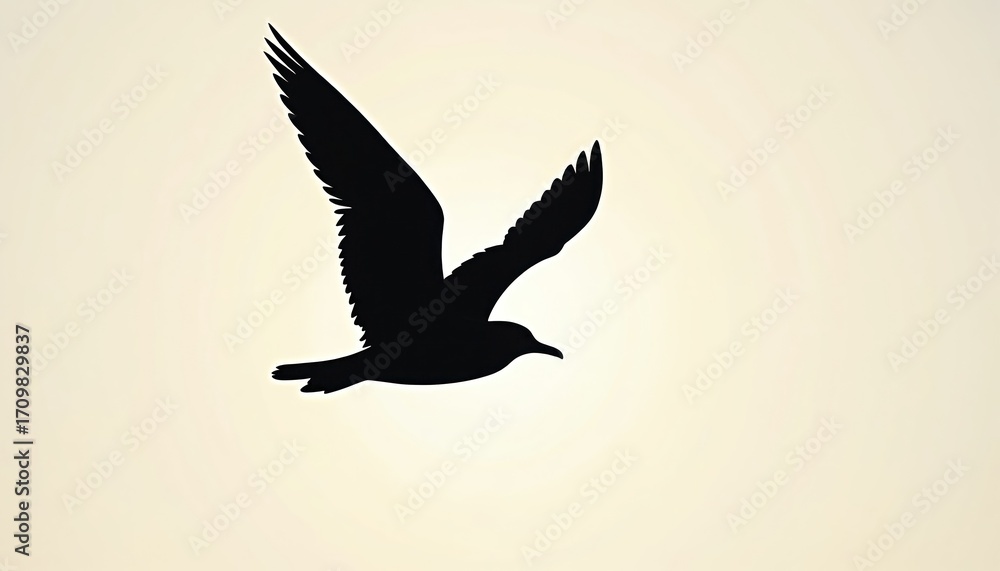 Obraz premium Silhouette of black seagull in flight against pale, soft background. Bird wings spread wide, showing graceful form, smooth lines as glides through air. Minimalist wildlife design conveys freedom,