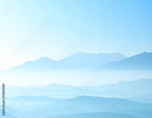 Layered Blue Peaks Under Clear Sky