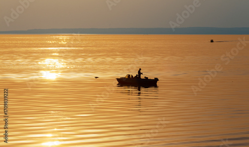 Boat on the Volga River at sunset