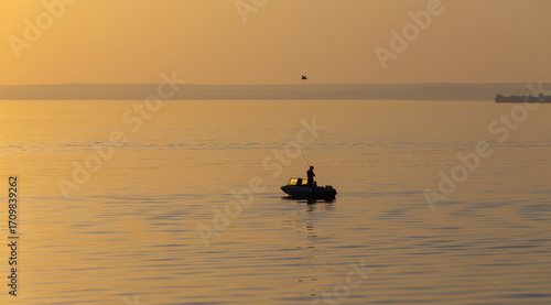 Boat on the Volga River at sunset